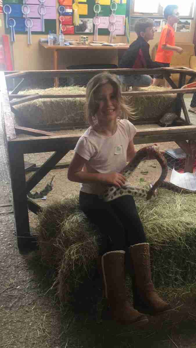 Libby holding snake at Karoben