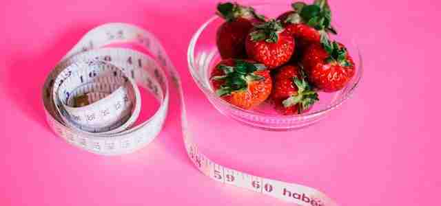 strawberries and measuring tape lose weight