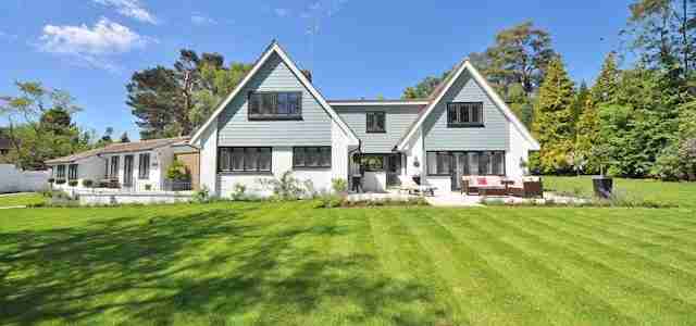 beautiful big white house in landscaped grounds